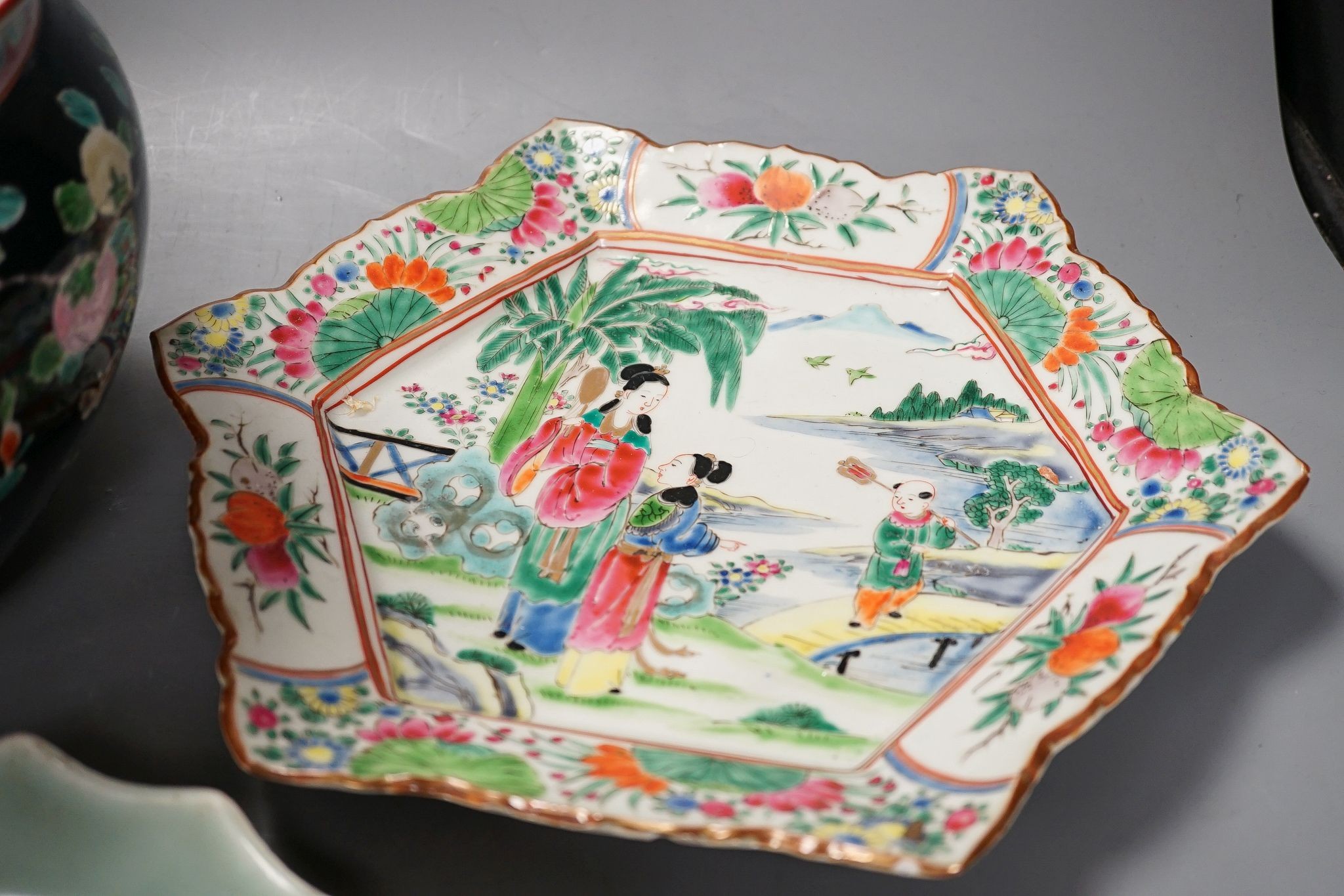Three late 19th century Japanese porcelain dishes and a jardiniere, 19 cms high.
